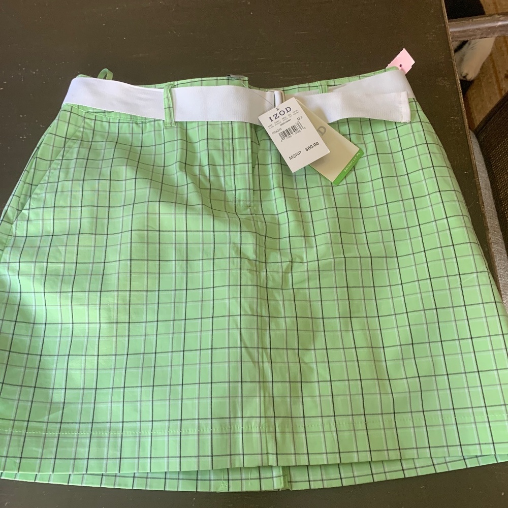 Izod women’s golf skirt. NWT . Retail 60 . With belt